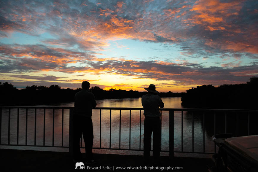 Two guests photograph the sunrise on a photo safari with Edward Selfe in South Luangwa National Park
