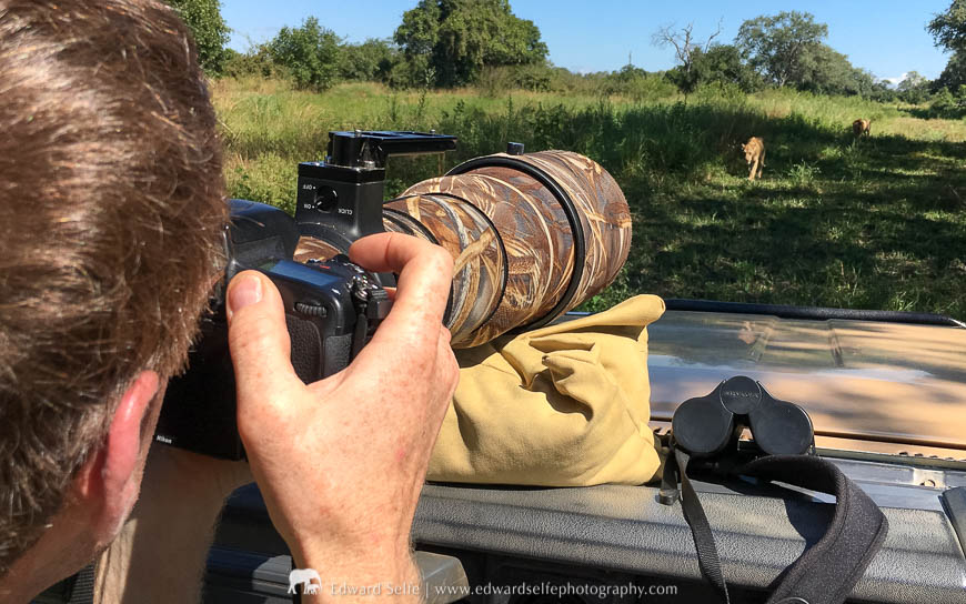 A photographer takes photos of a leopard on a photo safari with Edward Selfe in South Luangwa National Park